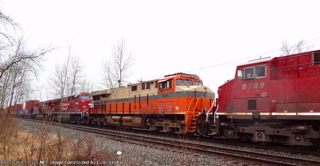 NS 8105 Interstate Heritage unit, in the #4 locomotive position of a 6 locomotive lash up, E/B through Pratt Siding with a unit stack train from Robert's Bank, Delta, B.C., heading for Chicago Illinois